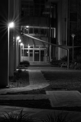 Dark alleyway, dimly lit, with lines and diaganols