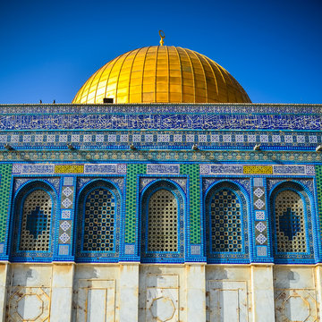 Facade of The Dome of The Rock with a clear blue sky