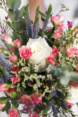 wedding colourful bouquet in bride's hands white background