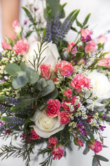 wedding colourful bouquet in bride's hands white background