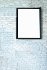 Black wooden picture frame on the old brick wall interior decoration
