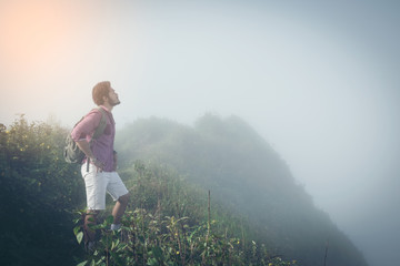 trekker pauses above Hill to take in the view of the Northern Thailand.