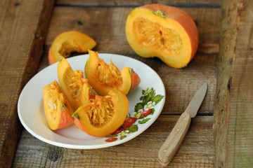 Delicious fresh orange pumpkin on wooden table 