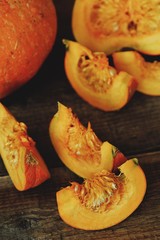 Delicious fresh orange pumpkin on wooden table 