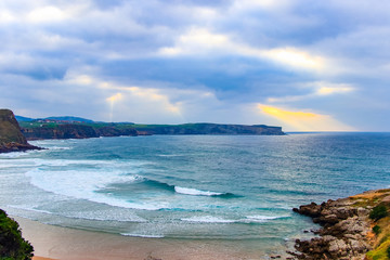 Cliffs of Suances at sunset , which stretches around the confluence of the rivers Saja and Besaya. It has excellent beaches, like that of Los Locos, which is ideal for surfing