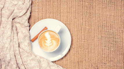 Cup of coffee or chai tea with latte art. Leasure time concept. Pastel colors