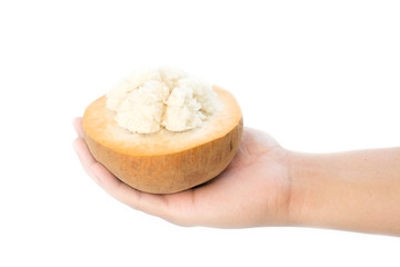 Santol fruit on hand isolated on white background.