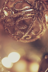 Christmas background. Christmas lace ball on a blurry  brown warm background. 