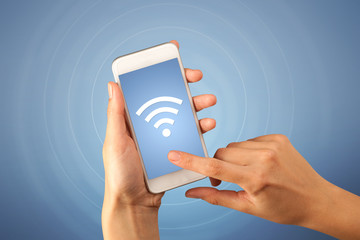 Female hand holding smartphone