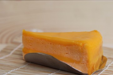 Orange cake on wood background