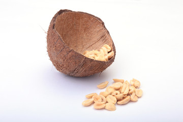 Roasted peeled peanuts in Handmade bowl of coconut, Selective Focus