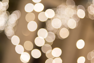 gold abstract burred background with bokeh defocused lights, snow, Christmas and new year theme background