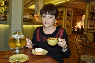 woman is drinking tea