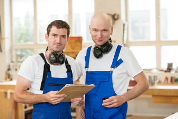 two worker in a carpenter's workshop