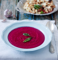 Beet cream soup with garlic. Rustic style, selective focus.