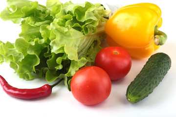 Assorted vegetables, fresh bell pepper, tomato, chilli pepper, cucumber and lettuce isolated on white background. Selective focus.