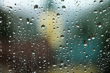Raindrops on window glass , rainy day