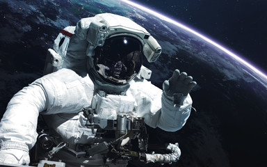 Astronaut. Abstract space wallpaper. Universe filled with stars, nebulas, galaxies and planets....