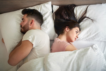 Man and woman in bed in the morning
