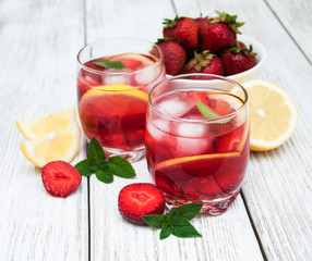 Glasses of lemonade with strawberries