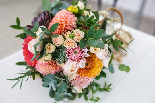bright wedding bouquet of summer dahlias and roses