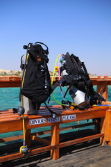 Scuba diving equipment on on the resort footbridge © jbphotographylt