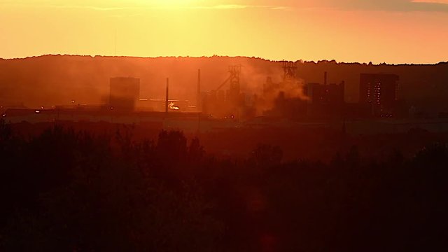Factory steam sunset