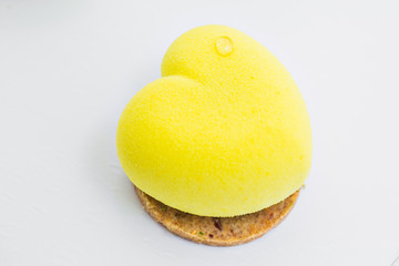 Yellow cake in the shape of heart. lemone desert