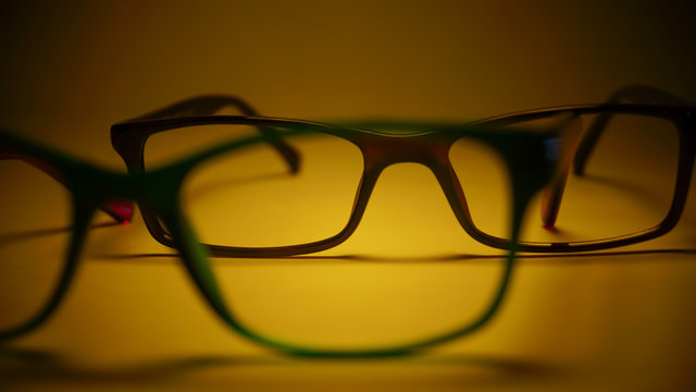Rimmed eyeglasses closeup on a white background