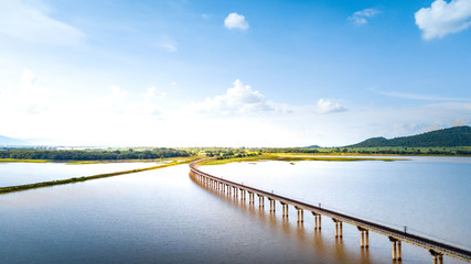 Aerial Photo Railway Curve Track to the mountains is located on the River Pasak River Dam,Lopburi...
