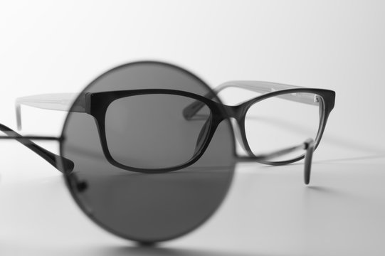 Rimmed eyeglasses closeup on a white background