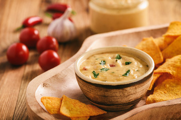 Mexican cheese dip served with nachos.