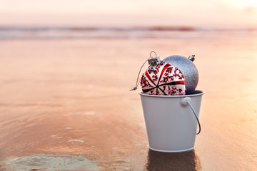 Sunset on the beach and Christmas decorations, holiday concept