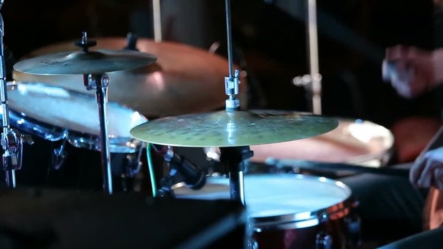 Rock drummer plays music on concert