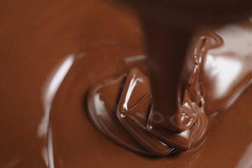 pouring melted premium dark chocolate from above