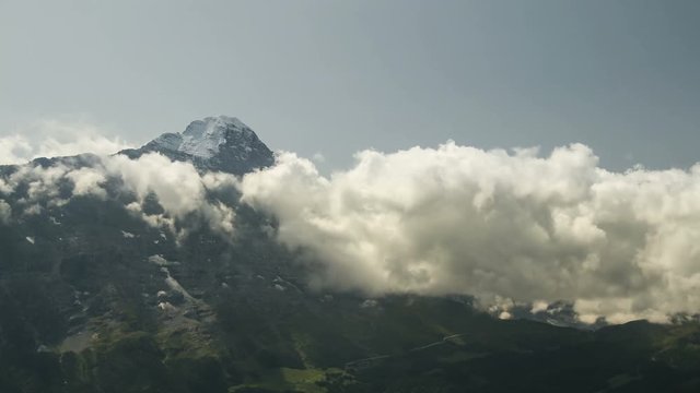 Time lapse clouds float in the valley under the iconic swiss mountain Eiger near Grindelwald village Bern region Switzerland Alps travel Europe