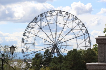 Ferris wheel, attraction, landscape, urban landscape, park, sky, clouds, metal structure, trees, architecture, wheel, blue, green, travel, entertainment