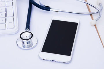 mobile phone with stethoscope, health concept