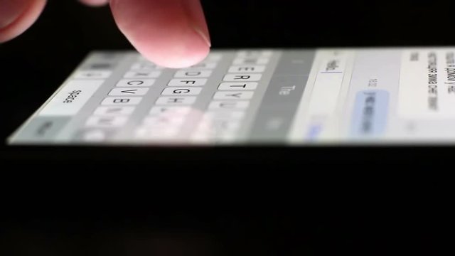 Typing On Phone At Night
