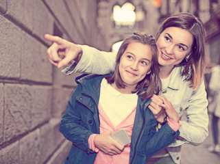 Mother giving explanations to daughter during tour