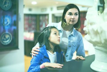 Mother and daughter in museum