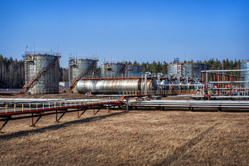 Large oil tank in industrial plant at twilight