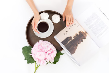 Breakfast with coffee, marshmallows, a pink hydrangea, and a magazine