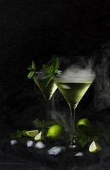 Martini or mint liqueur with lime, selective focus