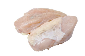 raw chicken breast dressing salt and pepper on white background