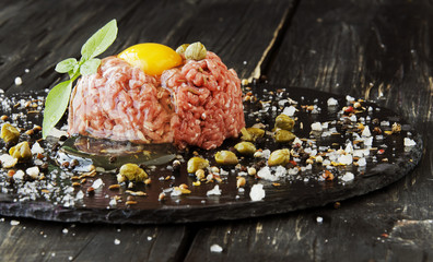 Steak tartare of raw minced meat with salt and spices
