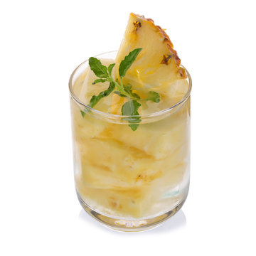 Glasses of pineapple juice with pieces of pineapple healthy drink concept