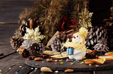 figurine Snowman on Christmas BACKGROUND , selective focus