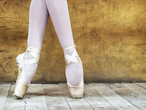 Legs of a ballerina in pointe shoes. Copy space.