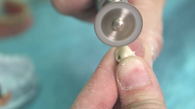 Lab technician cut dental prothesis